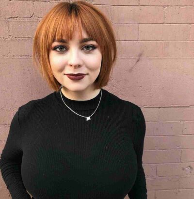 Chic Copper Chin-Length Bob with Bangs